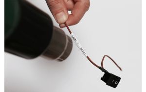 Термо-шлаух лента Brother HSE-211E, 5.2mm, Black on White Heat Shrink Tube